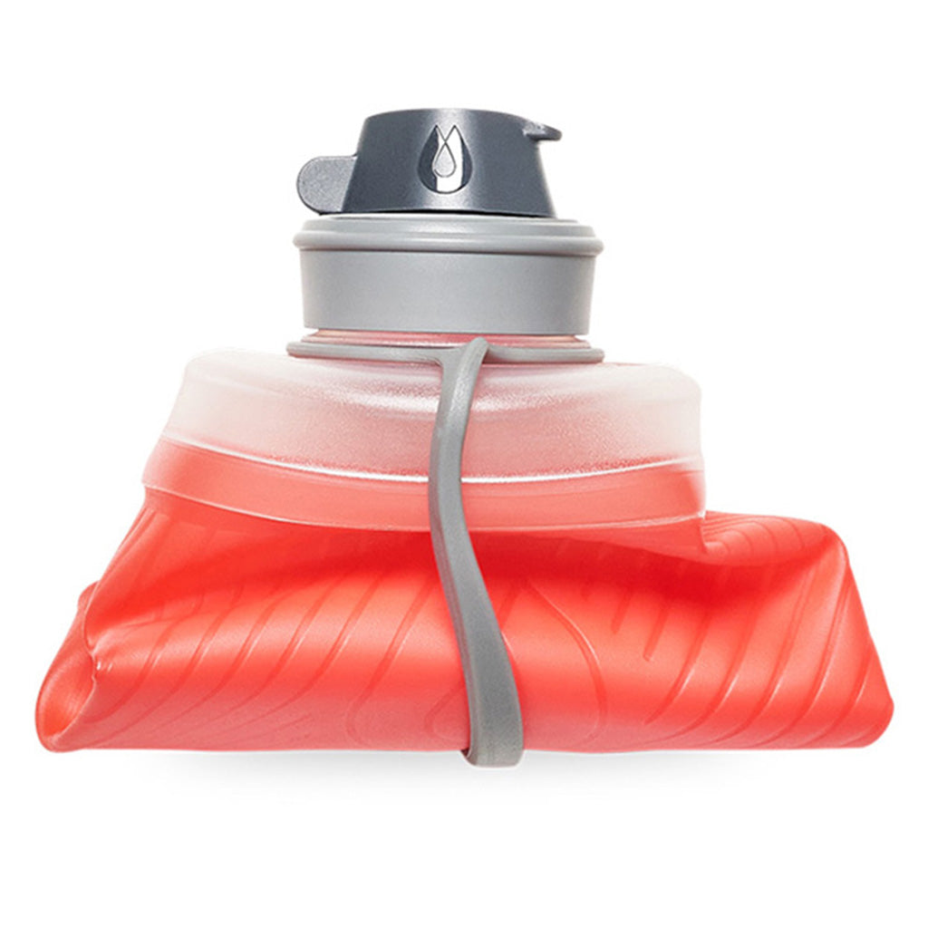 Rolled-up Hydrapak Flux 750ml Redwood bottle demonstrating its packability.
