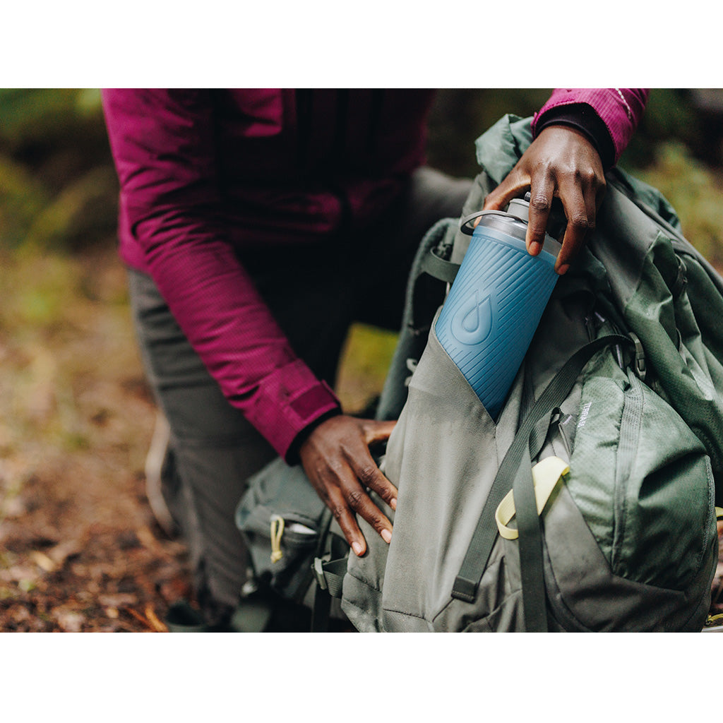 Hydrapak logo on the Tahoe Blue-colored 1 Liter Flux Bottle.
