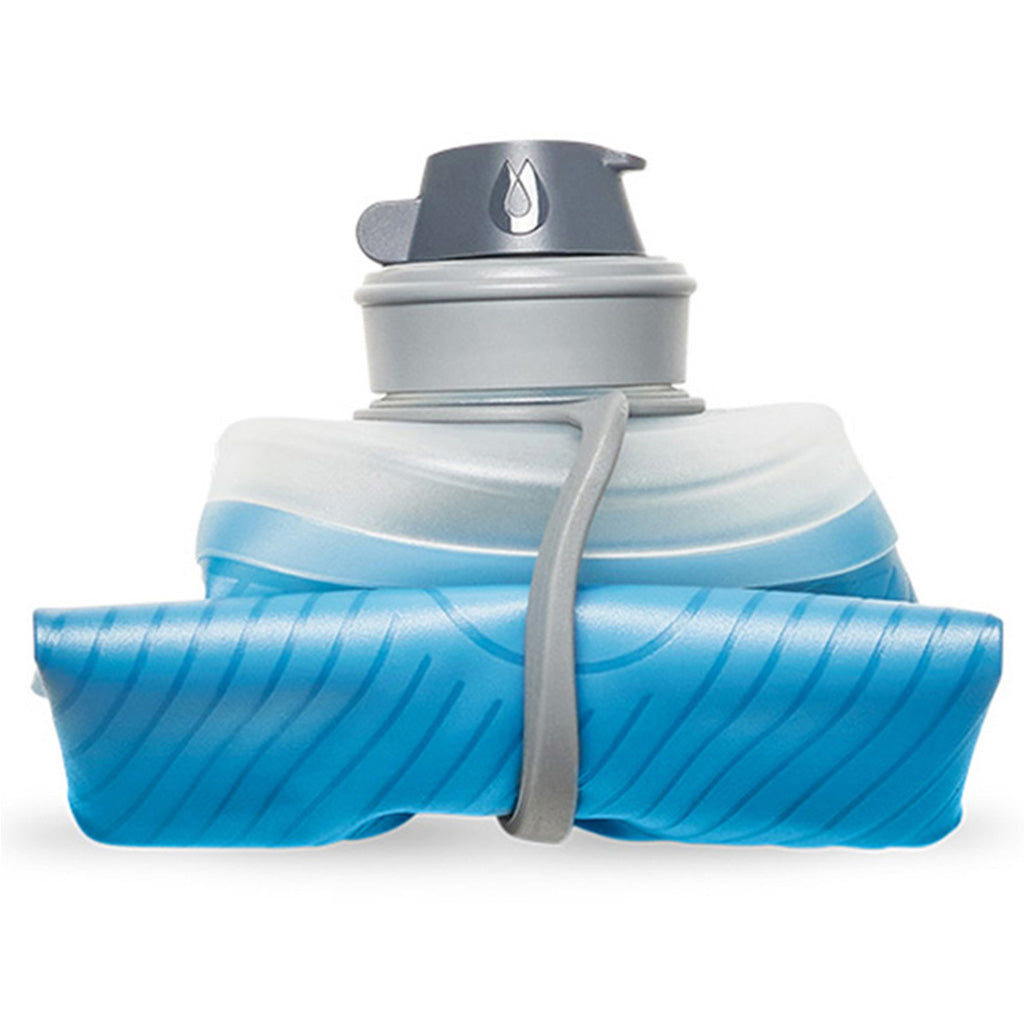Rolled-up Hydrapak Flux 1L Tahoe Blue bottle demonstrating its packability.
