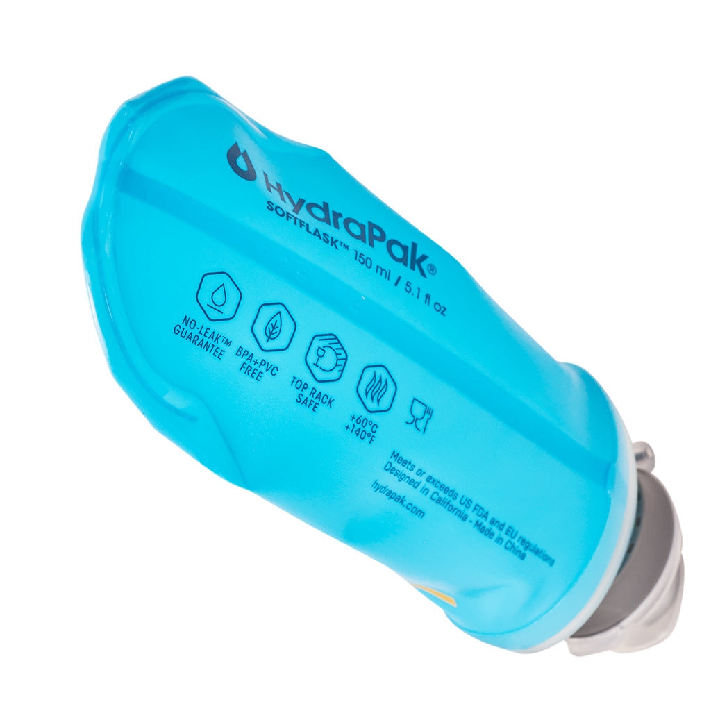 The 150ml Malibu Blue Hydrapak Softflask, demonstrating its ability to collapse for easy storage.