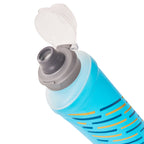 The cap of the Malibu Blue Hydrapak Softflask (250ml) alongside its folded form, illustrating its packability.