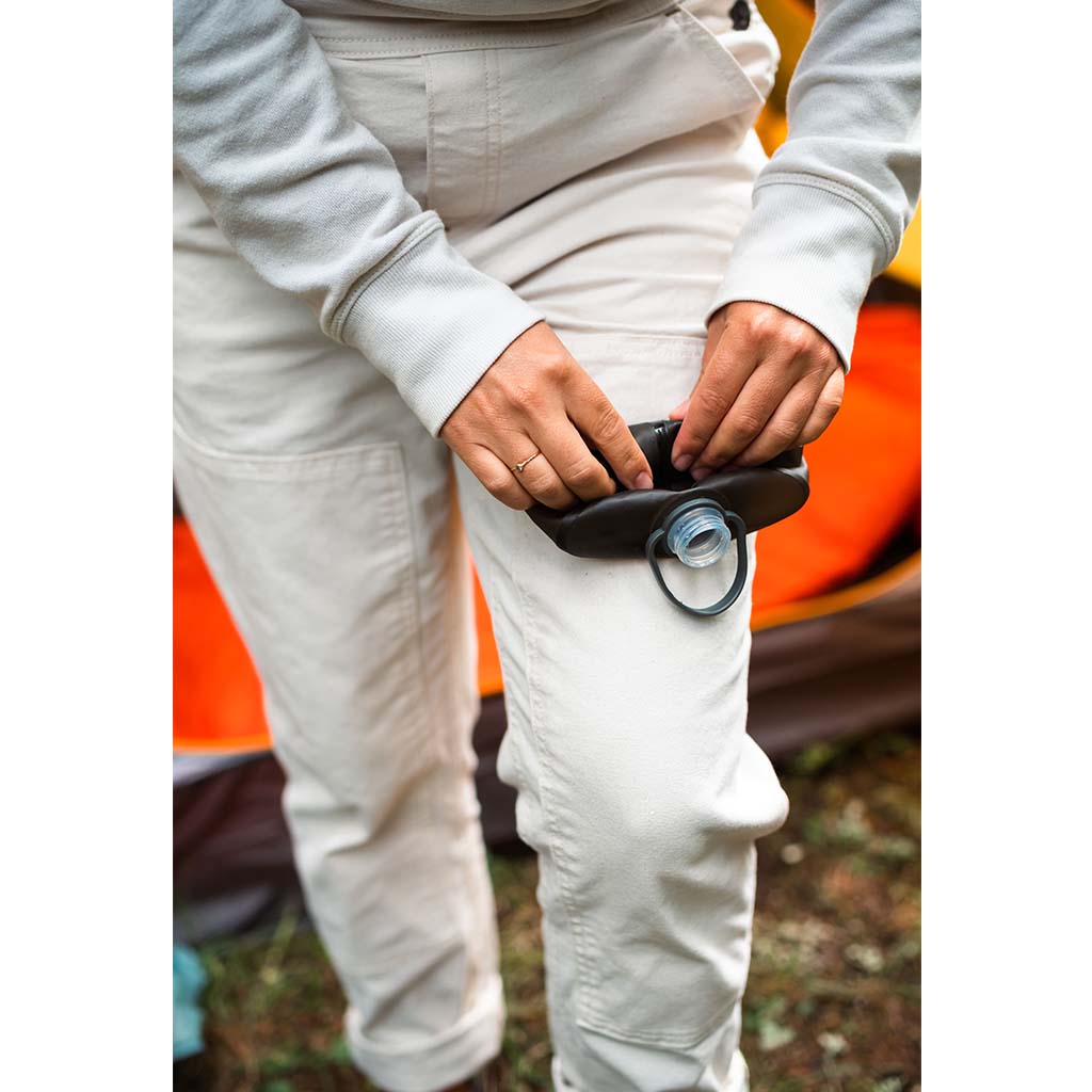 See how the 1-liter Hydrapak Stow in Mammoth Grey effortlessly folds down when empty, a testament to its packability.