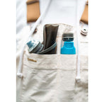 The Hydrapak Stow 1 Liter in its distinctive Mammoth Grey, showcasing its compressible form for ultimate packability.