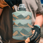 Close-up of the Hydrapak Stow Flexible Bottle, Mountain Edition, showing the cap and the flexible material in Sutro Green.