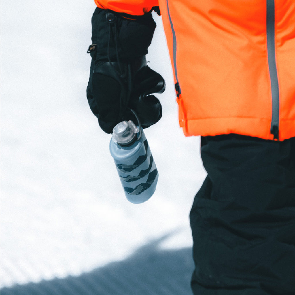 Tahoe Blue Hydrapak Stow 350ml, folded for compact storage and with its handle ready for carrying.