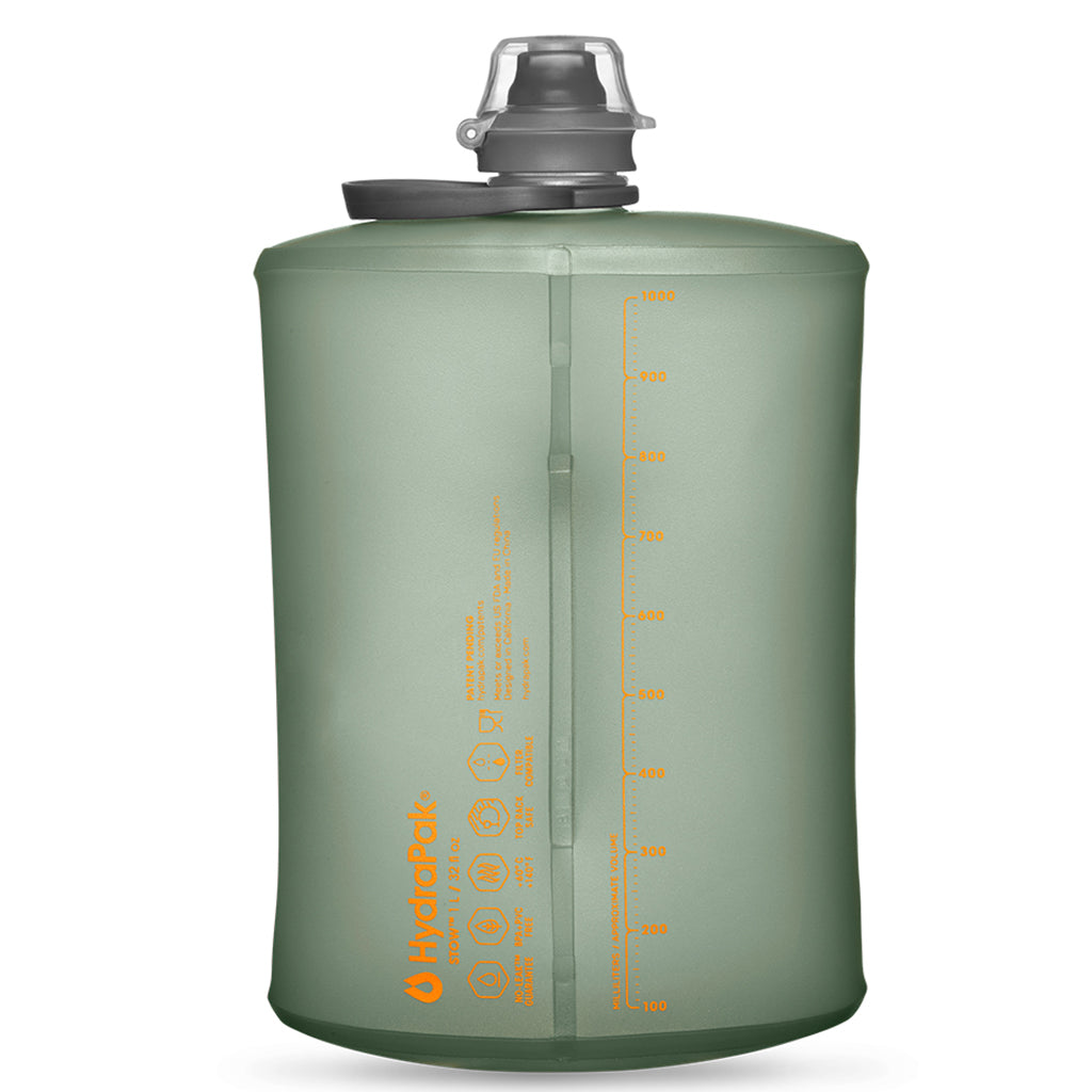 Flexible Sutro Green Hydrapak Stow 1 Liter bottle, with visible measurement markings along the side.