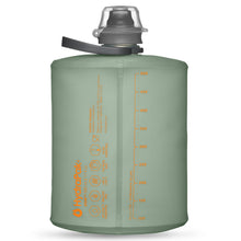 The compact form factor of the 500ml Sutro Green Hydrapak Stow bottle, emphasizing its space-saving measurements when empty or partially full.