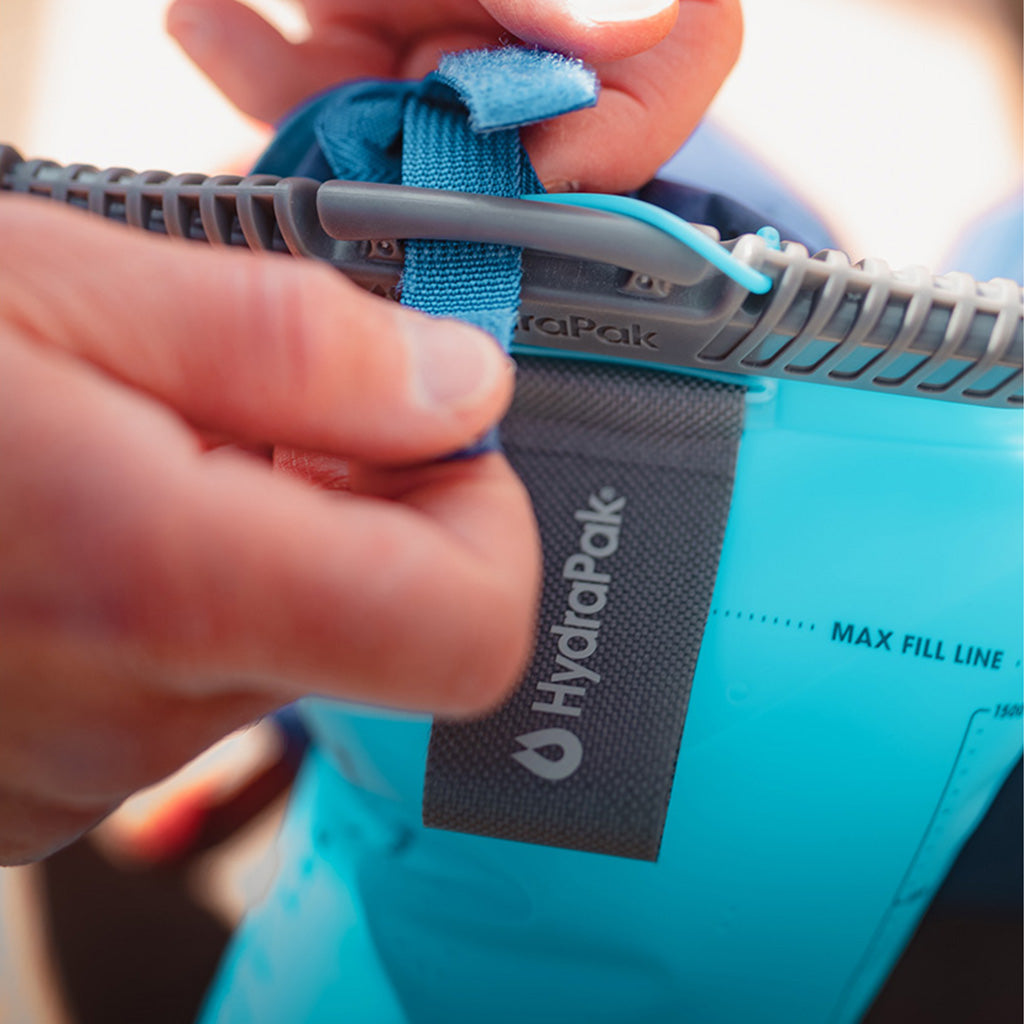 Malibu Blue Hydrapak Velocity 1.5L: showcasing its universal hanger, designed for easy and secure hanging within a variety of hydration packs before your weekend trek.