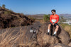 Man sitting on a rock wearing Man wearing jorhat snug-fit cycling jersey