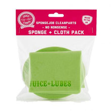A folded yellow Juice Lubes Sponge Job microfiber cloth next to a matching sponge, highlighting the two-piece combo for bicycle cleaning.