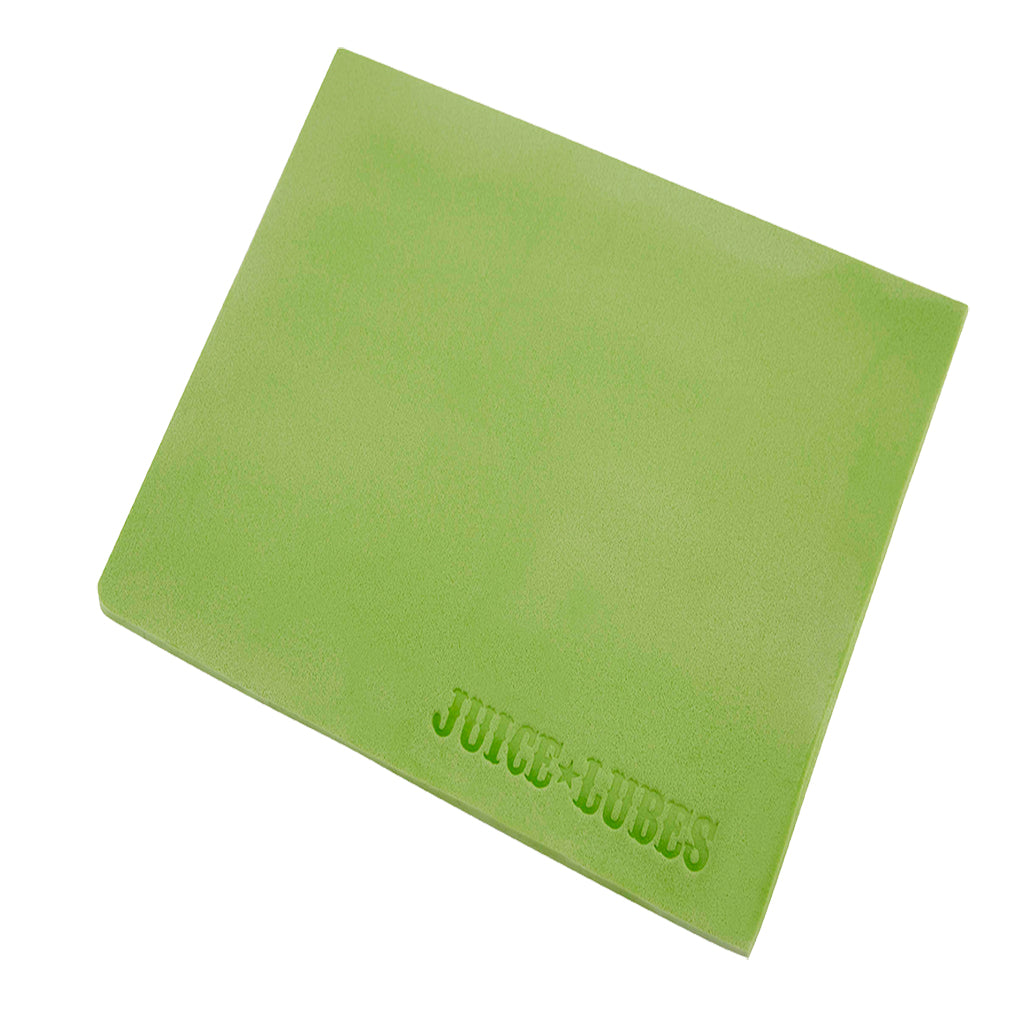 The Juice Lubes Sponge Job sponge and cloth being used to clean a bicycle's frame and hard-to-reach areas, demonstrating their practical application.