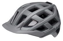 KED Crom helmet in dark grey matte, featuring a carbon fiber design and a reflective logo, ideal for cycling enthusiasts
