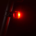 Lezyne rear light mounted on seat post with rubber strap