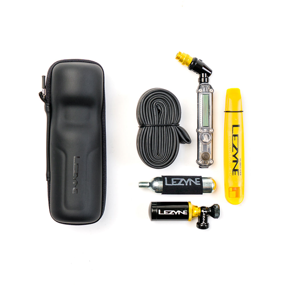 A Lezyne Flow Caddy securely fit into a water bottle cage on a bicycle frame
