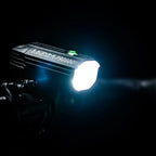 A night shot of the Lezyne Fusion Drive Pro 600+ light's powerful 600-lumen beam illuminating a dark trail.