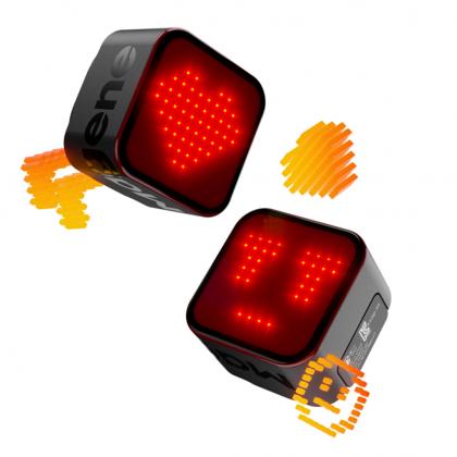 Two red LED cubes featuring smiley faces, designed as Magene L308 Intelligent Expression Tail Light for seatpost mounting.