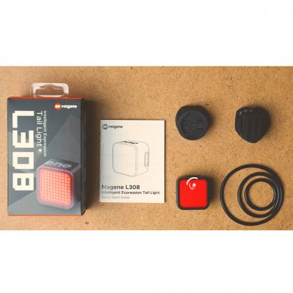 Image of the Magene L308 tail light featuring a red light, a red button, and a black button on a seatpost mount.
