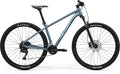 Merida BIG.NINE 100 hardtail mountain bike with Maxxis tires.