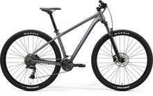 Side view of a Merida BIG.NINE 300 hardtail mountain bike with front suspension, Grey Frame and Maxxis tires.