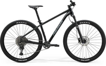 A black Merida BIG.NINE 400 hardtail mountain bike.

