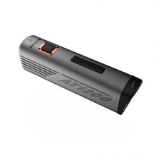  A stylish black and orange portable power bank, ideal for charging devices anywhere, with a focus on portability and efficiency.