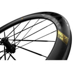 Close-up of a Magene EXAR Ultra DB607 carbon bicycle wheel showcasing a spoke, designed for disc brakes.
