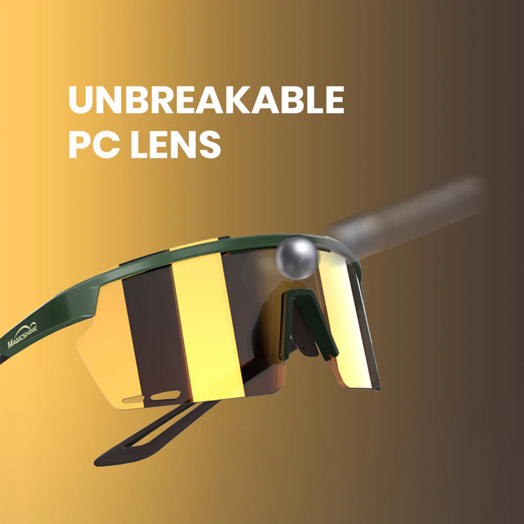 A close-up of the Magicshine Rouleur Photochromic Sports Sunglasses, focusing on the large wraparound lens in a golden-orange hue.