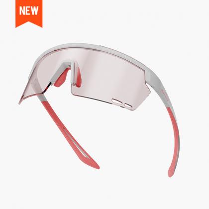 Close-up of Magicshine Rouler Night Vision cycling sunglasses in White/Pink, showcasing the expansive lens for exceptional optical precision and stylish white and pink aesthetics.