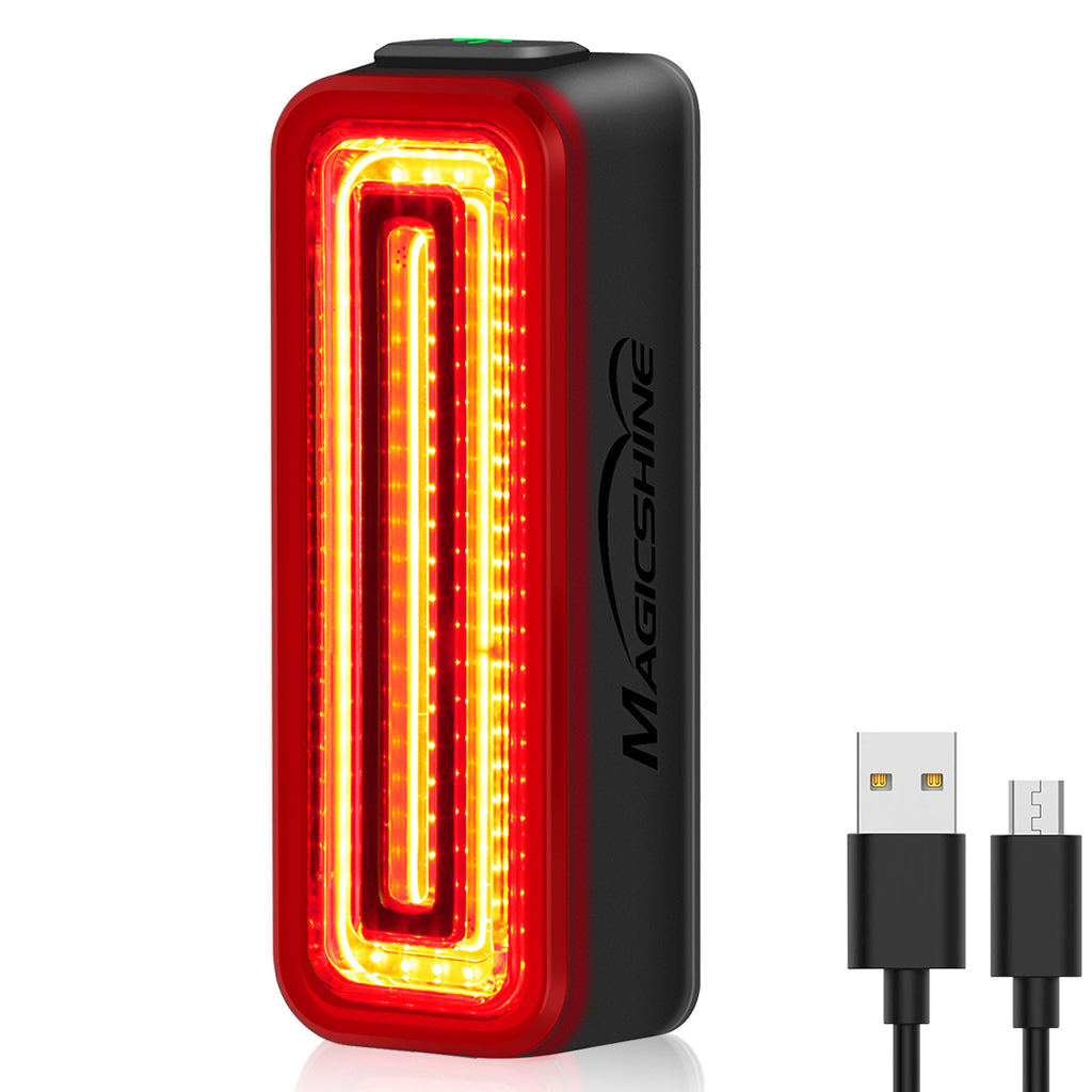 Detail of the Magicshine SEEMEE 100 V2.0 rear light, illustrating its intelligent ambient light sensor for adaptive day and night modes.