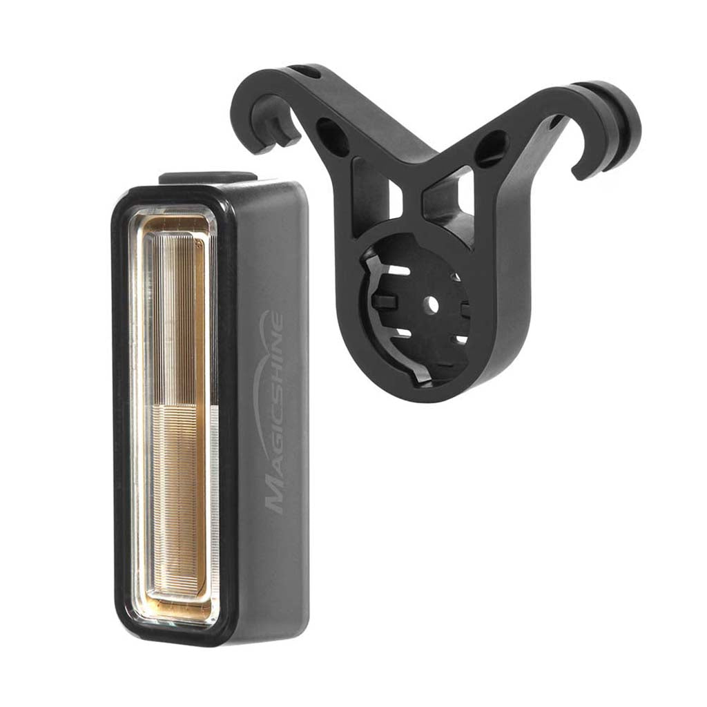 A rectangular Magicshine SEEMEE rear light shown next to a black V-shaped mount with two arms.