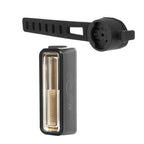 A rectangular Magicshine SEEMEE rear light shown below a black strap mount.