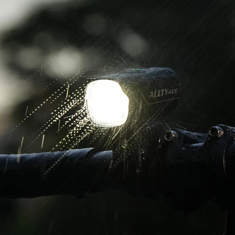 The Magicshine ALLTY 400 V2.0 front light ensuring a clear view of the road ahead with its powerful beam, easily rechargeable via its integrated USB charging port, and robustly waterproof for all conditions.