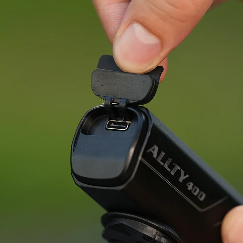 The Magicshine ALLTY 400 V2.0 bicycle front light, showcasing its powerful beam that enhances visibility for safer cycling, with a convenient USB charging port and a waterproof design for all-weather reliability.