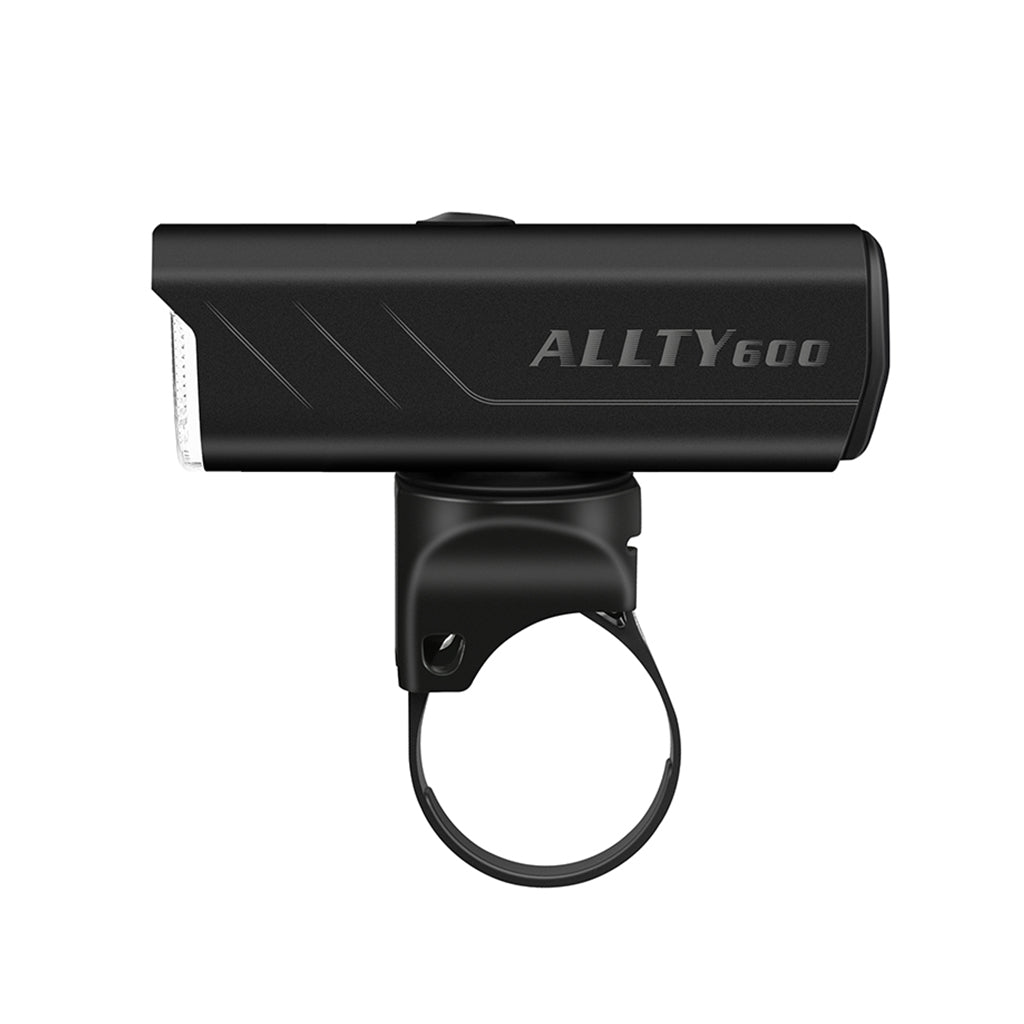 A black Magicshine ALLTY 600V2.0 bike light, shown at an angle, mounted on a handlebar strap, emphasizing its compact design and easy attachment.