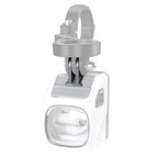 White Magicshine EVO 1700 bike light seen from above, mounted on a grey GoPro-style bracket.