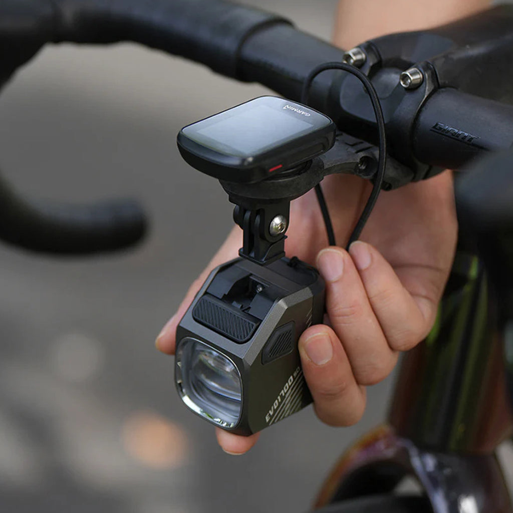 A close-up of the Magicshine EVO 1700SD bike light mounted on handlebars.