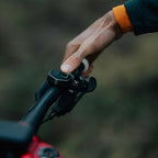 Magicshine Ray 1600B wireless remote mounted on handlebar for easy light control.