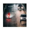 Cyclist on a road at night, illuminated by the Magicshine SEEMEE 200 V3.0 smart rear light