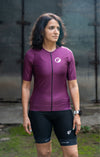 A women wearing purple colored maximus podium-fit cycling jersey