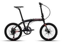 A black Magicshine ALLTY 1200U bike light is mounted underneath a bicycle handlebar, positioned directly below a Garmin cycling computer, creating a streamlined integrated setup.