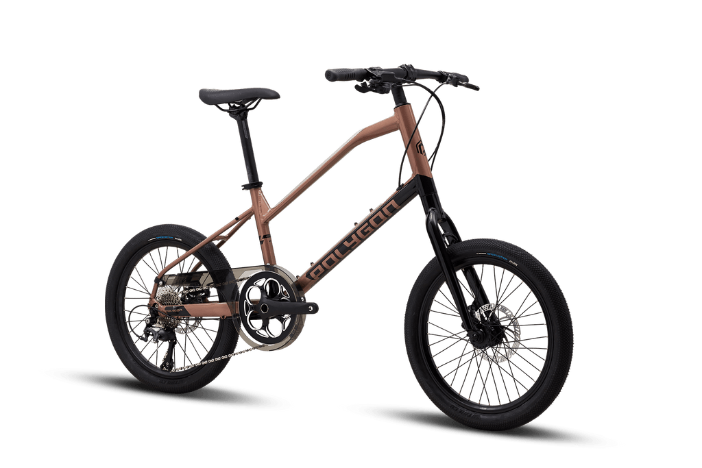 Side view of a Polygon Zeta 2 city bike in a metallic bronze finish, featuring disc brakes.

