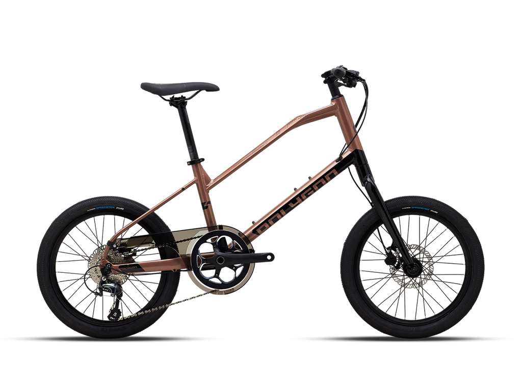 A bronze-colored Polygon Zeta 2 mini velo bike with black accents and small wheels.
