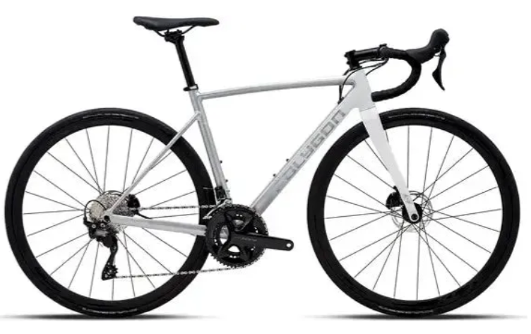A clean, side-on shot of a white Polygon Strattos S5 Disc road bike, highlighting its aerodynamic frame and components.