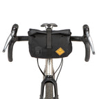 Waterproof rolltop cycling bag mounted on handlebars