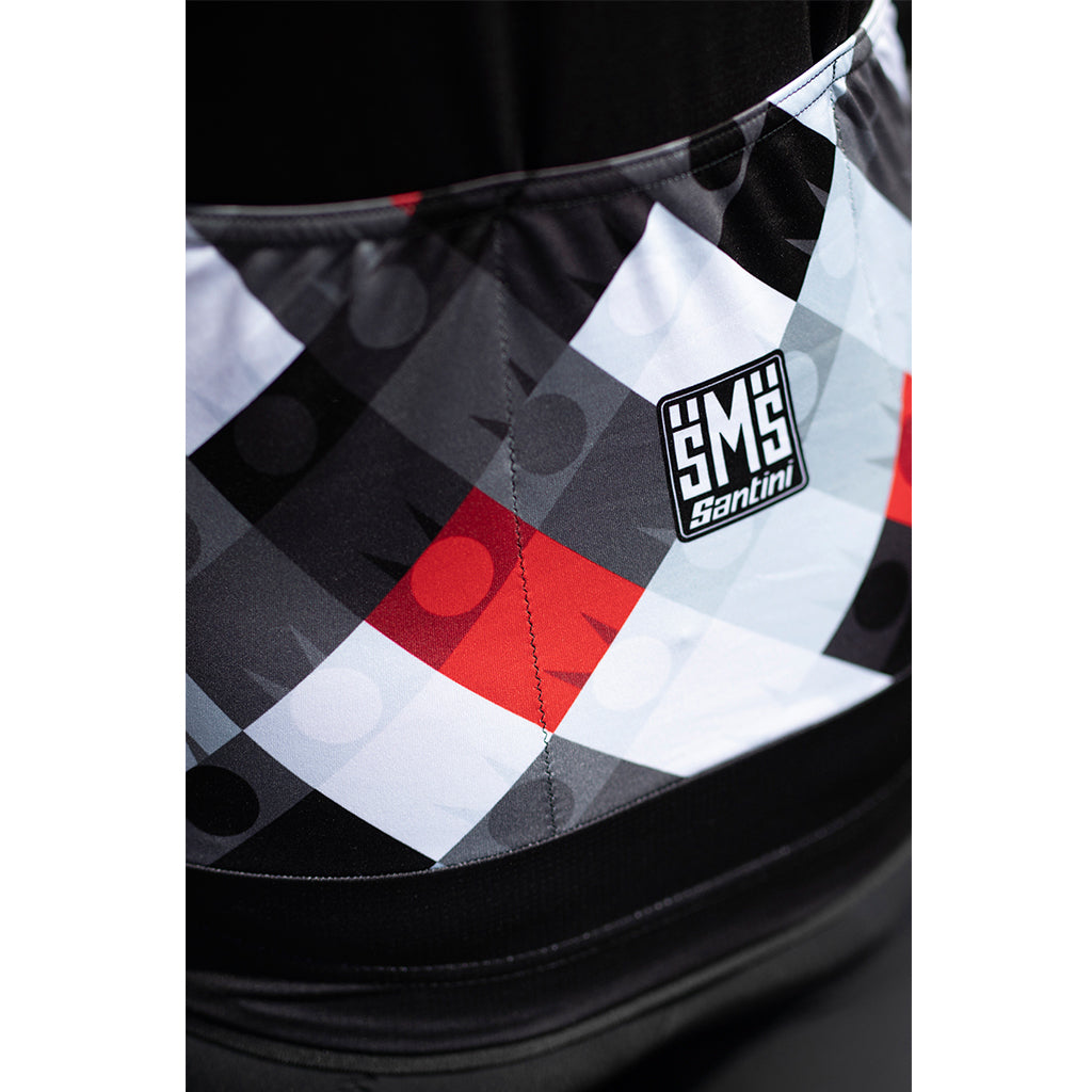 Close-up of the Santini jersey’s gripped elastic hem and Industry aero fabric sleeves, demonstrating how the jersey stays in place and supports aerodynamic performance.