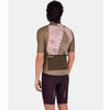 Cyclist wearing the Santini Note gravel jersey in military green, showcasing the triple back pockets and slim fit