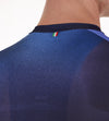 Detail shot of the Santini Ombra Eco Sleek jersey's recycled fabric in blue, illustrating its light texture that provides breathable sun protection with a second-skin feel.