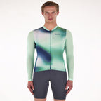 Close-up of the Santini Ombra Eco jersey's recycled fabric in green, highlighting its sleek fit and environmental commitment.

