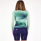 Rear view of Santini Ombra Eco green long sleeve cycling jersey on a rider, showcasing the triple back pockets and the sleek, aerodynamic fit.