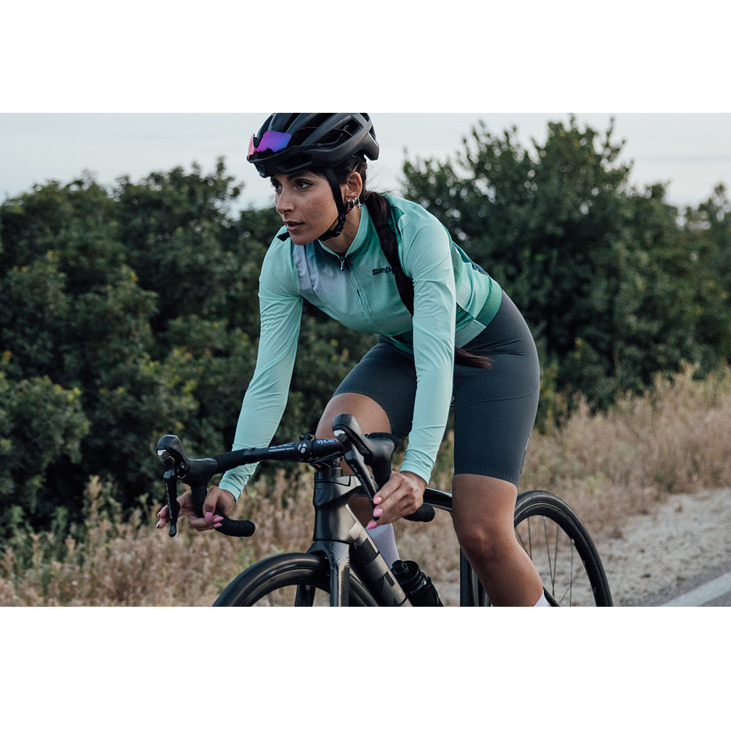 Model wearing the Santini Ombra Eco Sleek Long Sleeve Unisex Jersey in green, demonstrating its snug, performance-oriented fit.